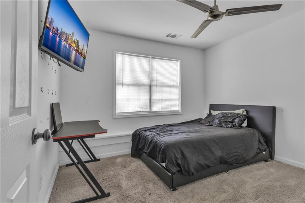 3985 Countryside Way Southwest Snellville, GA 30039 - Photo 31 of 40 a bedroom with a bed and a window