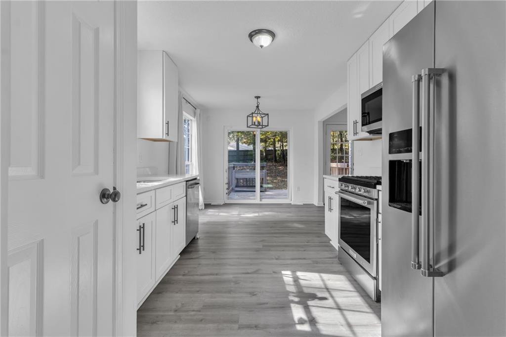 3985 Countryside Way Southwest Snellville, GA 30039 - Photo 4 of 40 a view of a kitchen with refrigerator and window