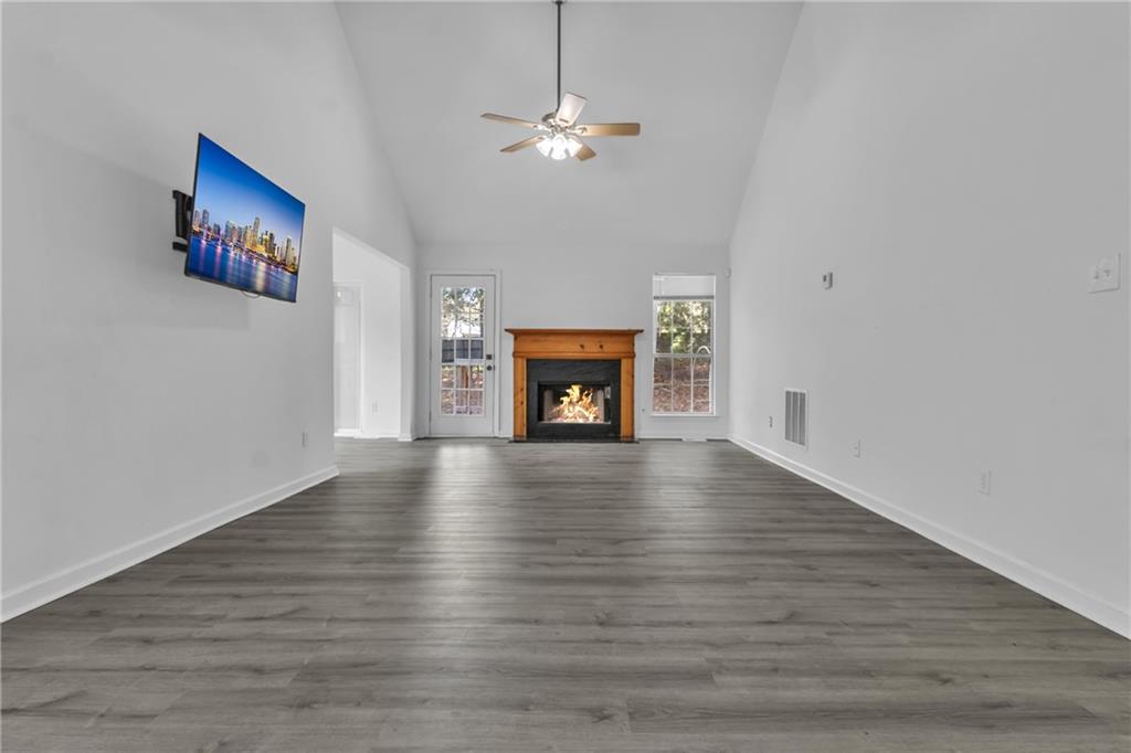 3985 Countryside Way Southwest Snellville, GA 30039 - Photo 8 of 40 a view of an empty room with wooden floor and a window