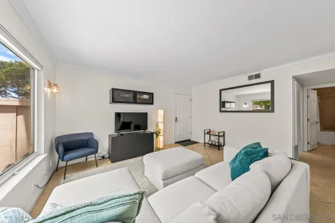 a living room with furniture and a window