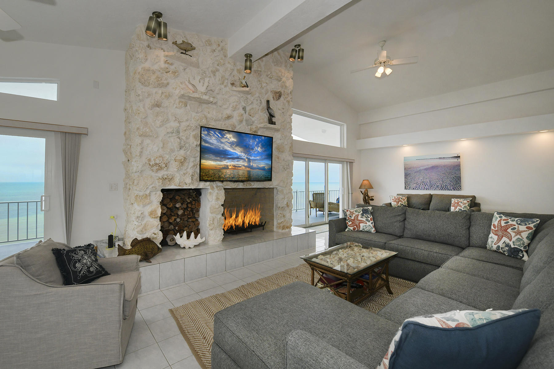 161-154 Sunset Drive Islamorada, FL 33036 - Photo 11 of 38 a living room with furniture and a flat screen tv