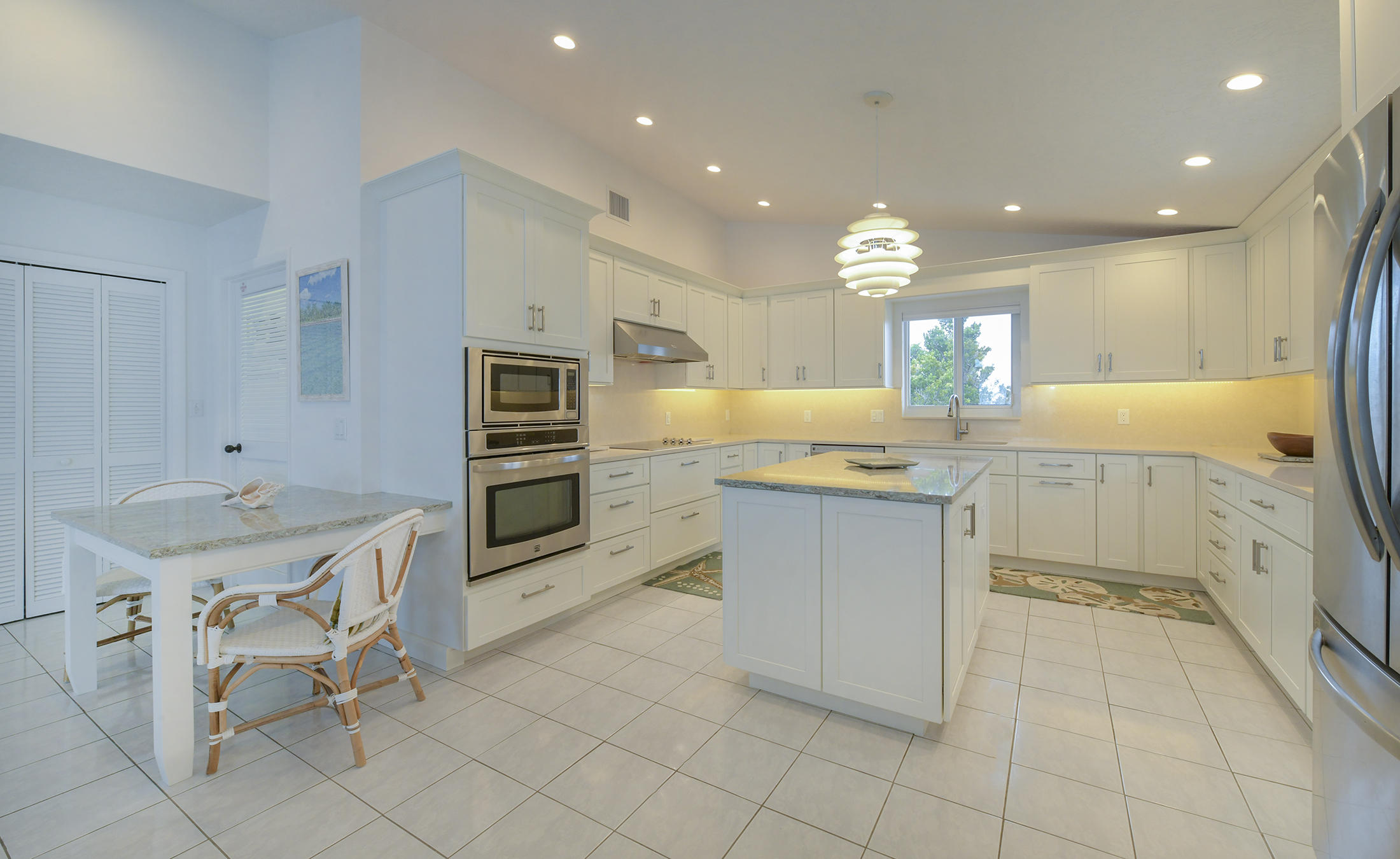 161-154 Sunset Drive Islamorada, FL 33036 - Photo 14 of 38 a kitchen with granite countertop a sink and cabinets