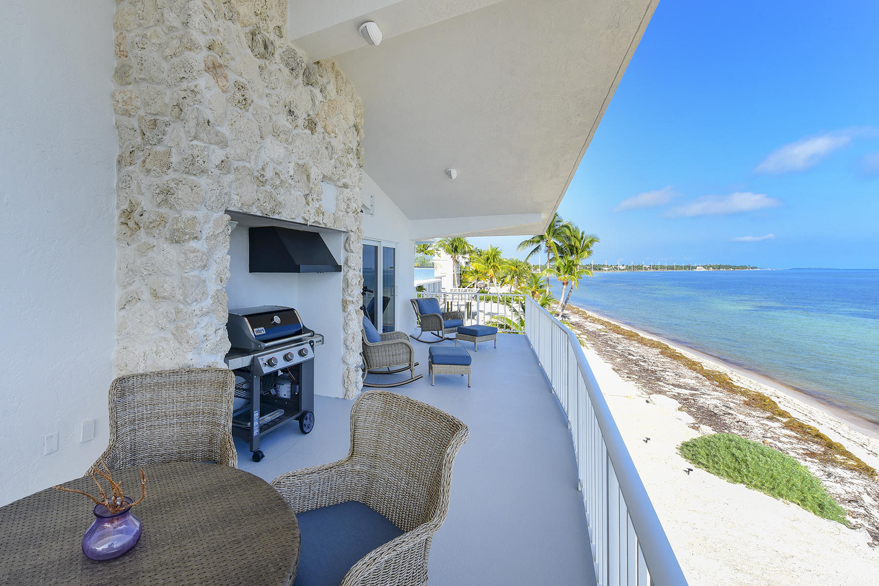 161-154 Sunset Drive Islamorada, FL 33036 - Photo 18 of 38 a living room with furniture and a floor to ceiling window