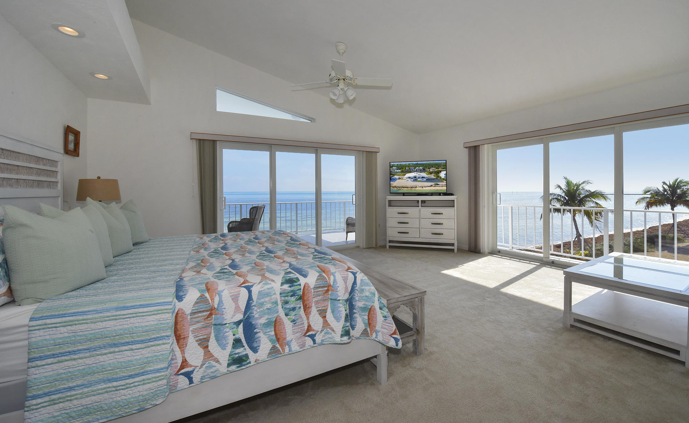 161-154 Sunset Drive Islamorada, FL 33036 - Photo 19 of 38 a bedroom with a bed and a large window