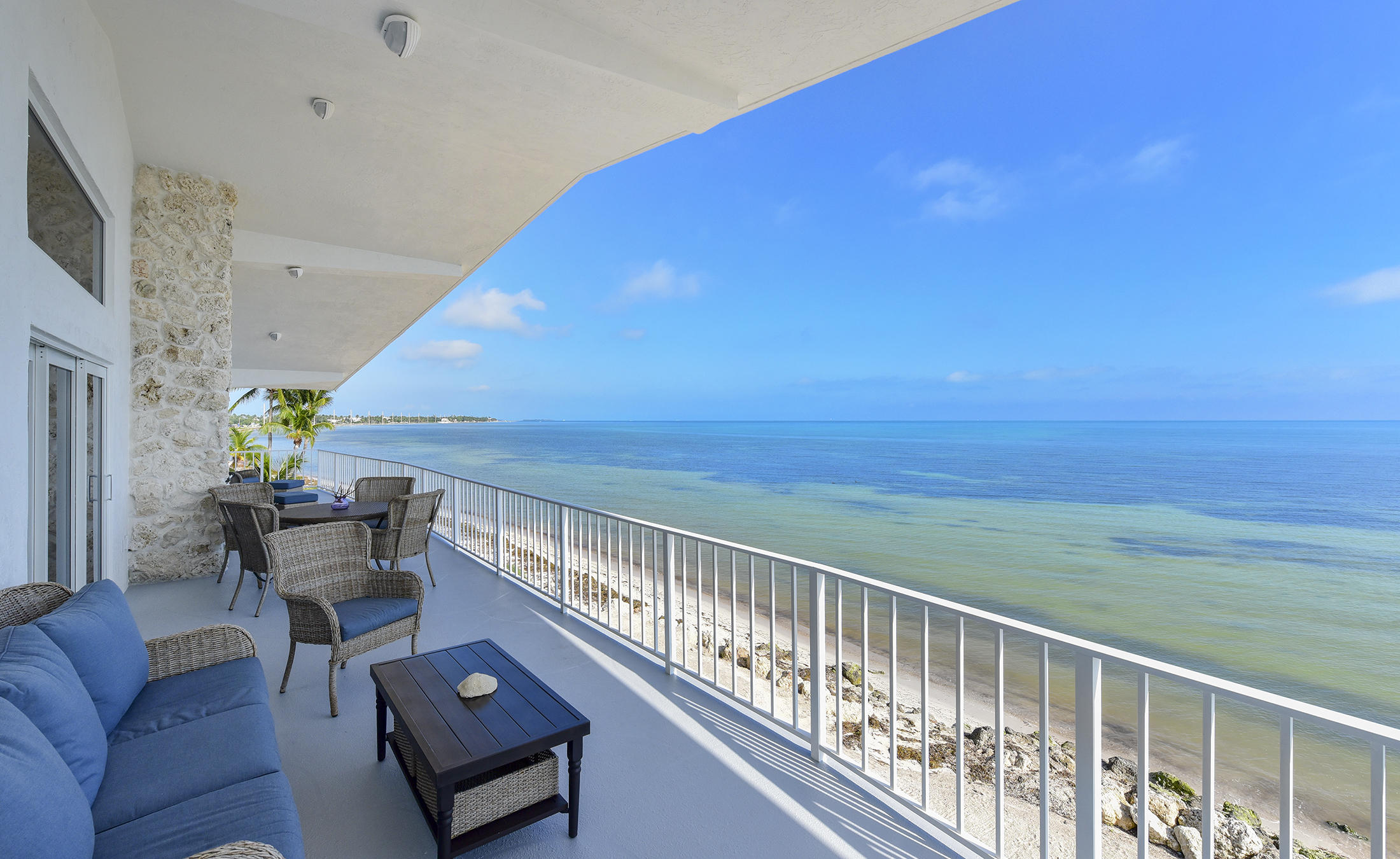 161-154 Sunset Drive Islamorada, FL 33036 - Photo 21 of 38 a view of a chairs and table in the balcony