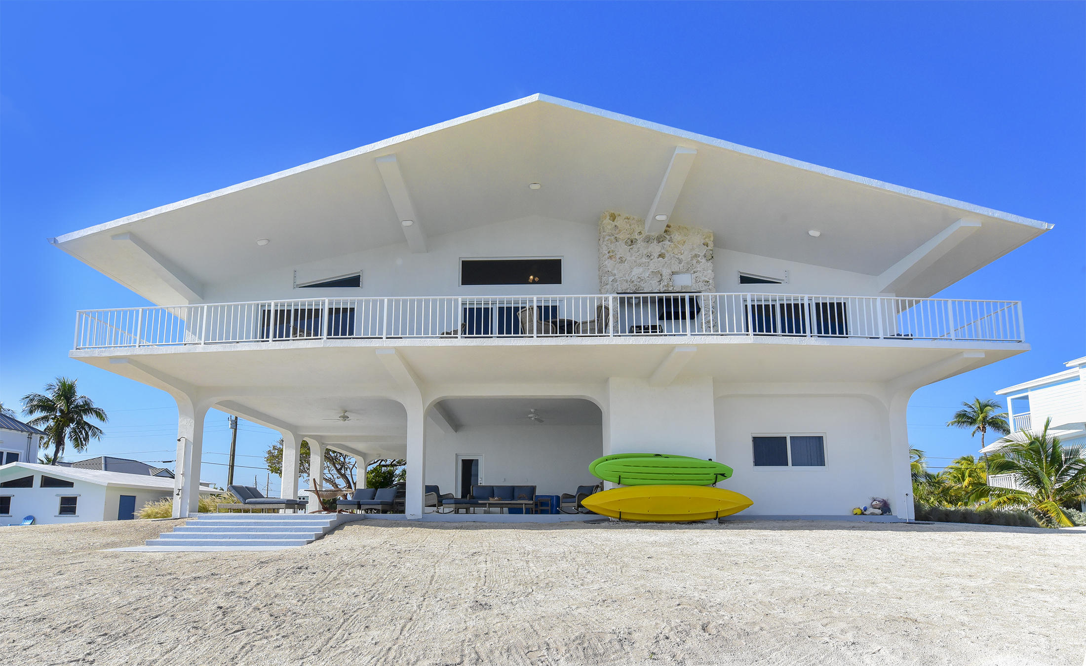 161-154 Sunset Drive Islamorada, FL 33036 - Photo 3 of 38 a front view of a house with a yard