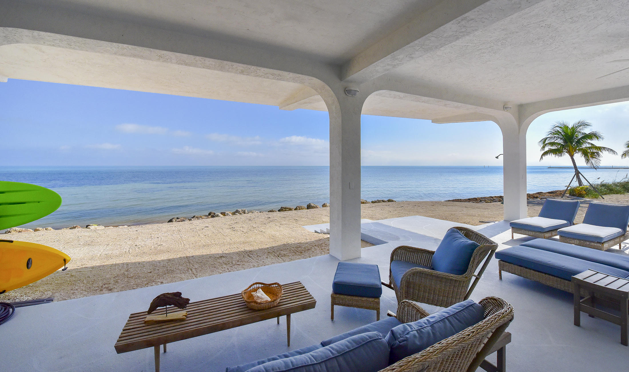161-154 Sunset Drive Islamorada, FL 33036 - Photo 33 of 38 a living room with furniture and a floor to ceiling window