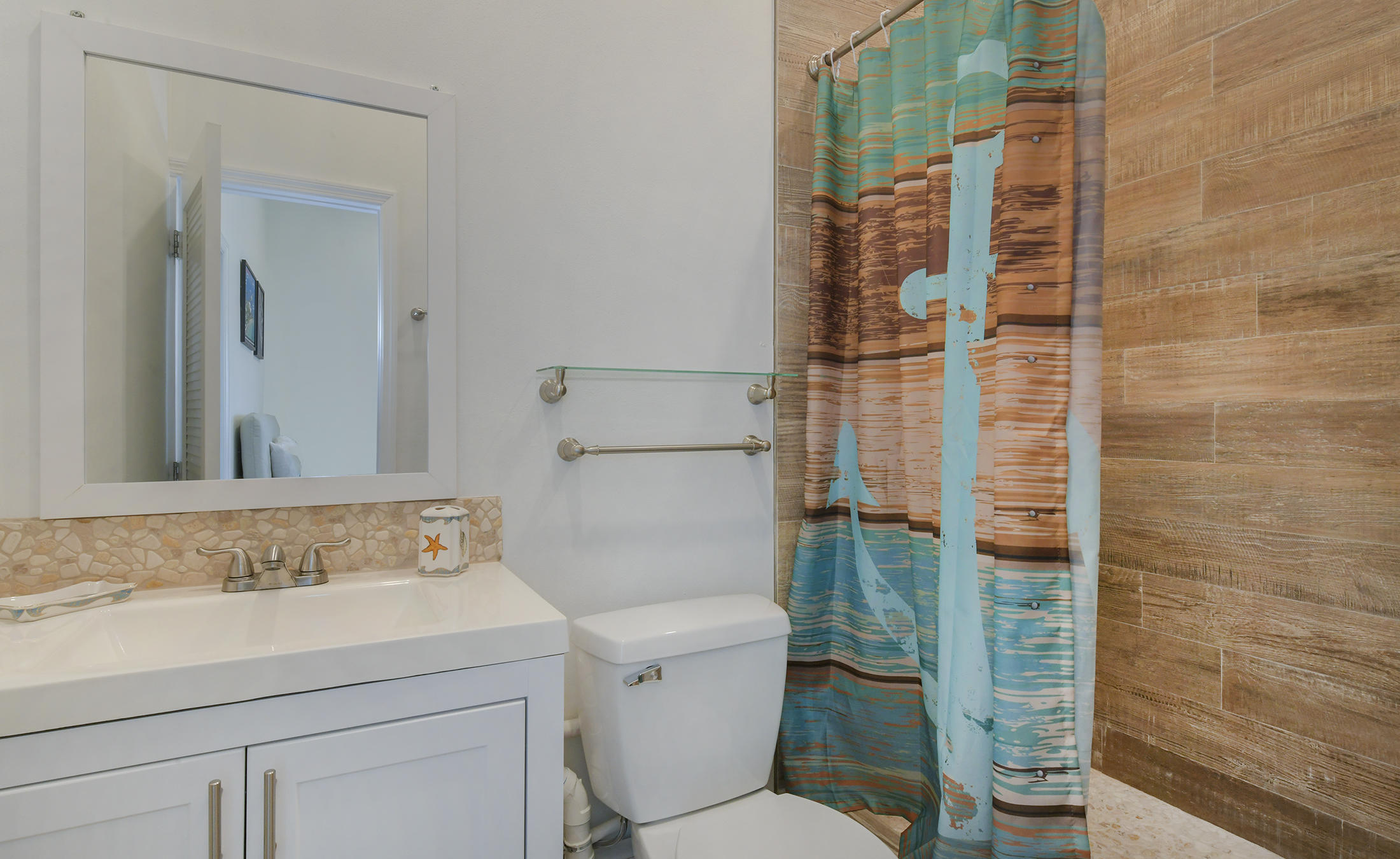 161-154 Sunset Drive Islamorada, FL 33036 - Photo 35 of 38 a bathroom with a sink toilet and shower
