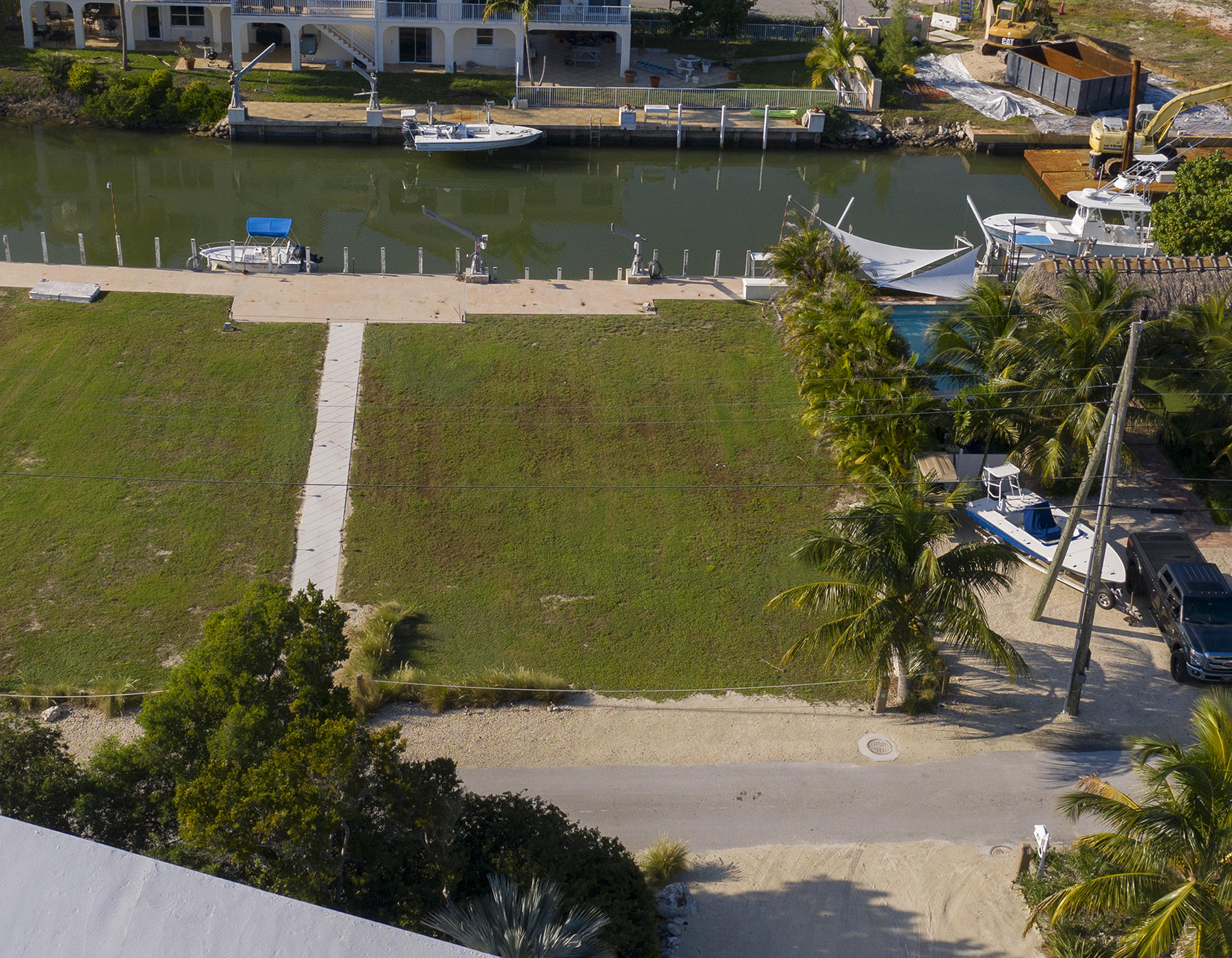 161-154 Sunset Drive Islamorada, FL 33036 - Photo 37 of 38 an aerial view of a house with a lake view