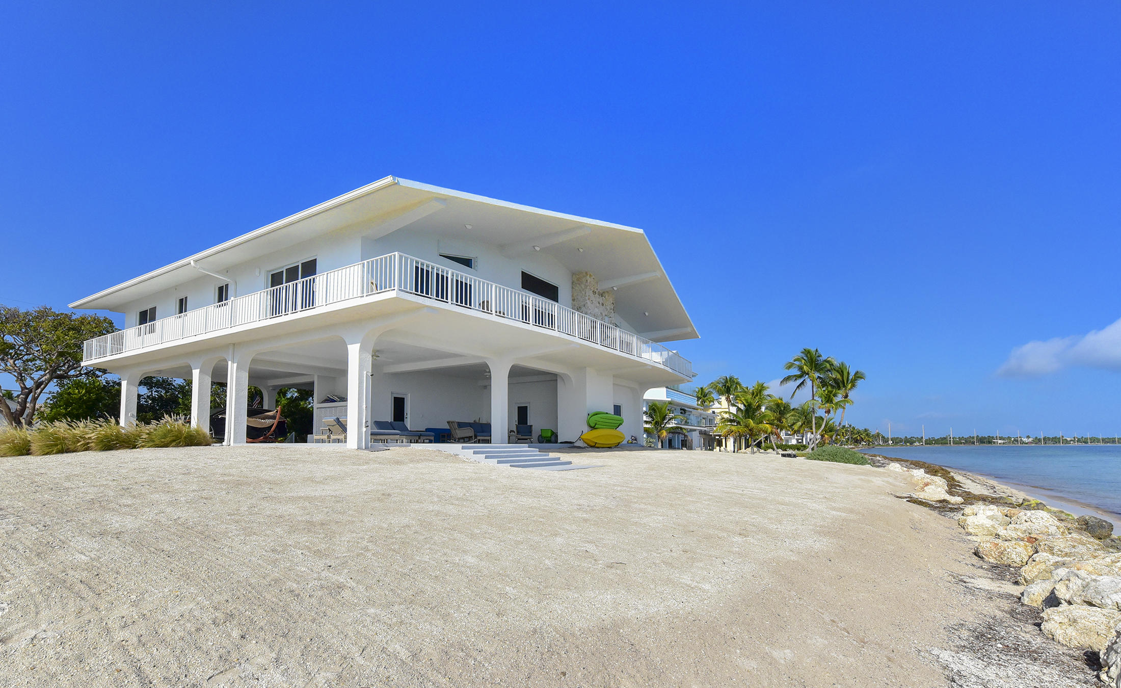 161-154 Sunset Drive Islamorada, FL 33036 - Photo 5 of 38 a view of a white building with a view of a building