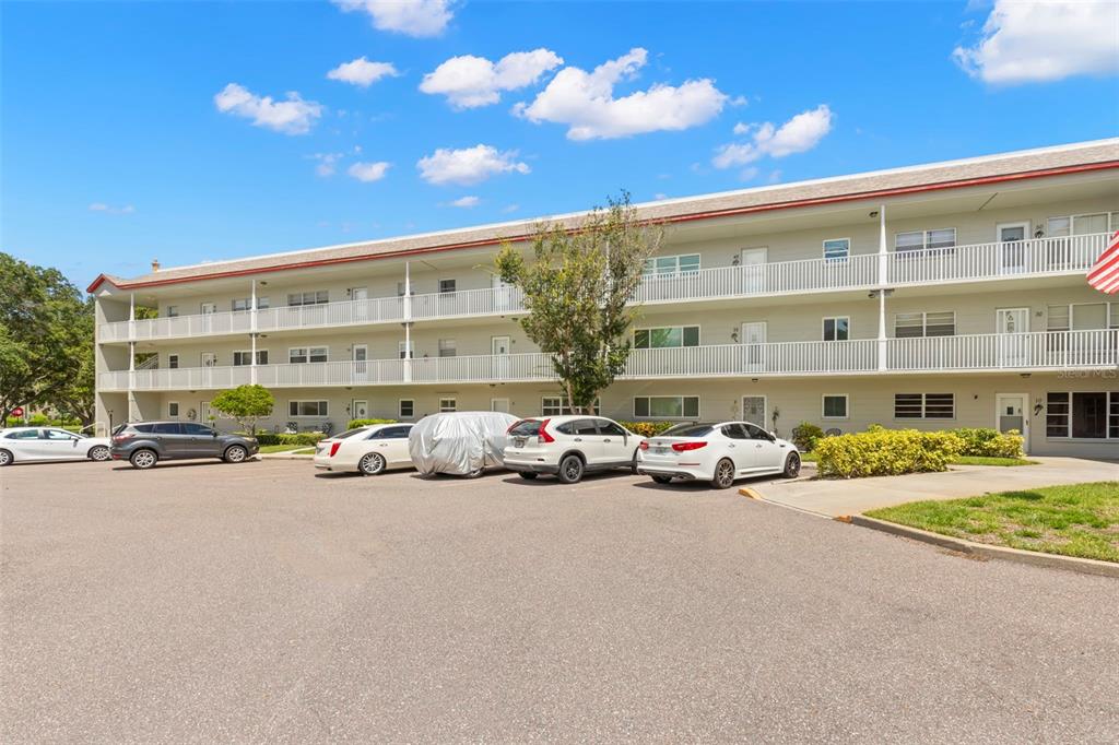 a view of a cars parked in front of a building