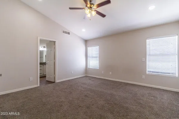 a view of an empty room with a window