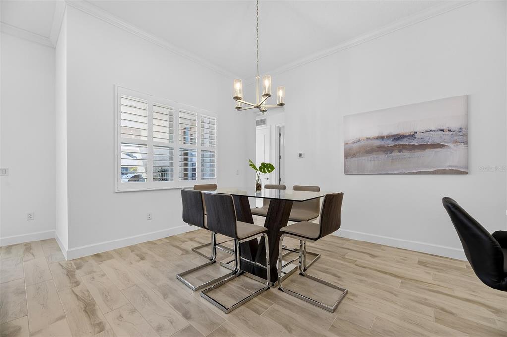 994 Signet Drive Apollo Beach, FL 33572 - Photo 28 of 98 a view of a dining room with furniture window and wooden floor