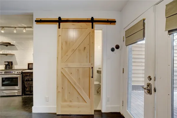a bathroom with a shower and a mirror