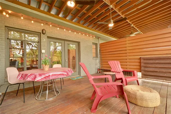 a dining room with furniture and wooden floor
