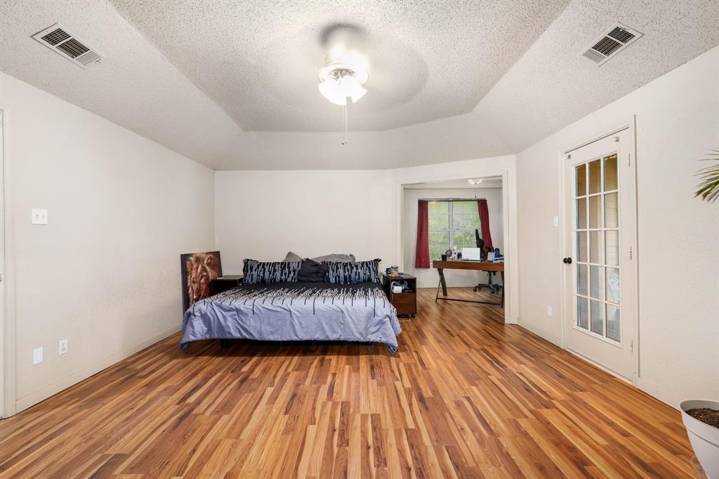104 Pecan Grove Lancaster, TX 75146 - Photo 20 of 33 a living room with furniture and a wooden floor