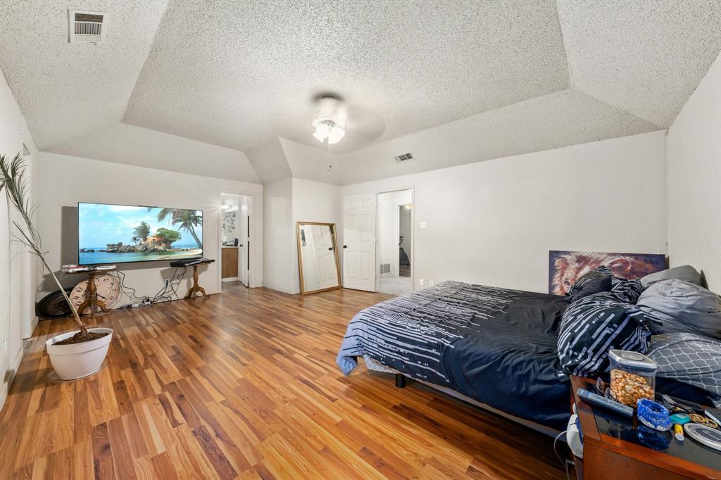 104 Pecan Grove Lancaster, TX 75146 - Photo 22 of 33 a bedroom with a bed and a view of living room