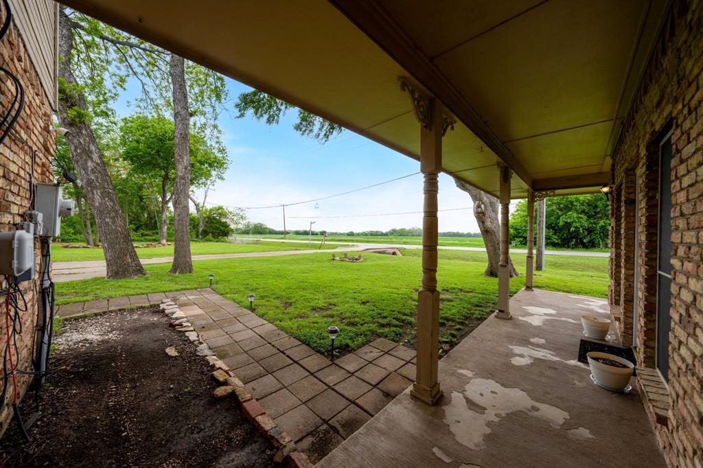 104 Pecan Grove Lancaster, TX 75146 - Photo 31 of 33 a view of a porch with a big yard