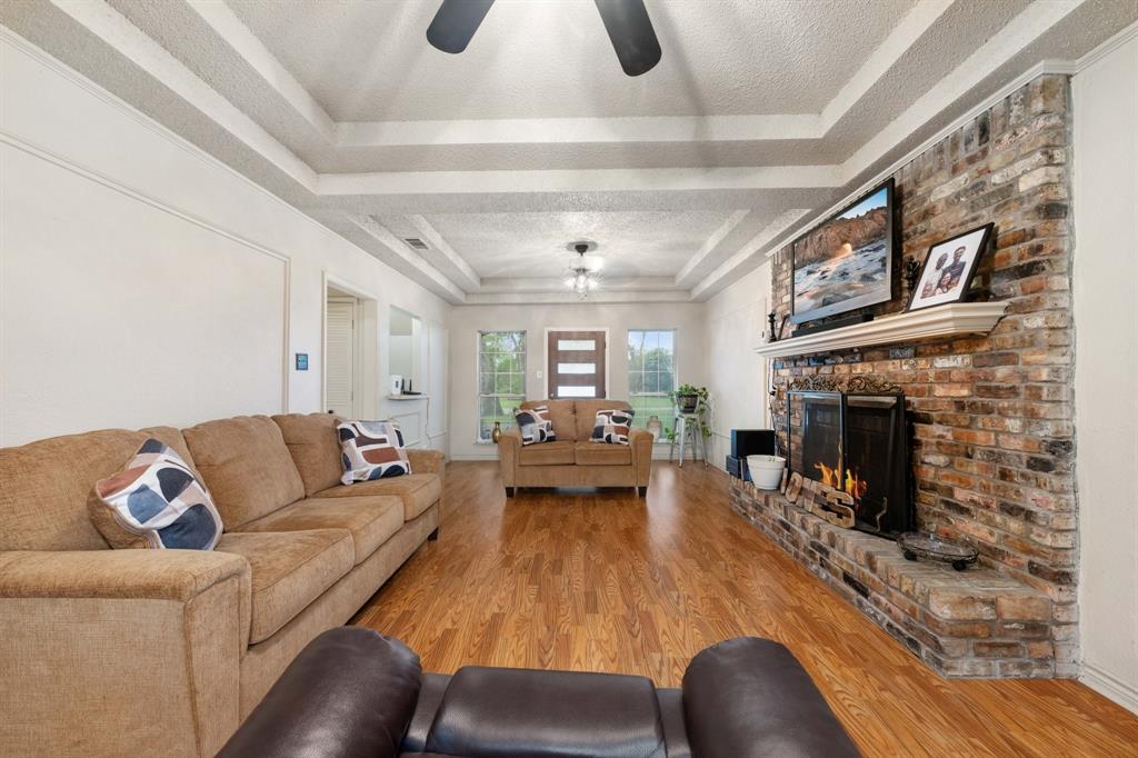 104 Pecan Grove Lancaster, TX 75146 - Photo 5 of 33 a living room with furniture and a fireplace