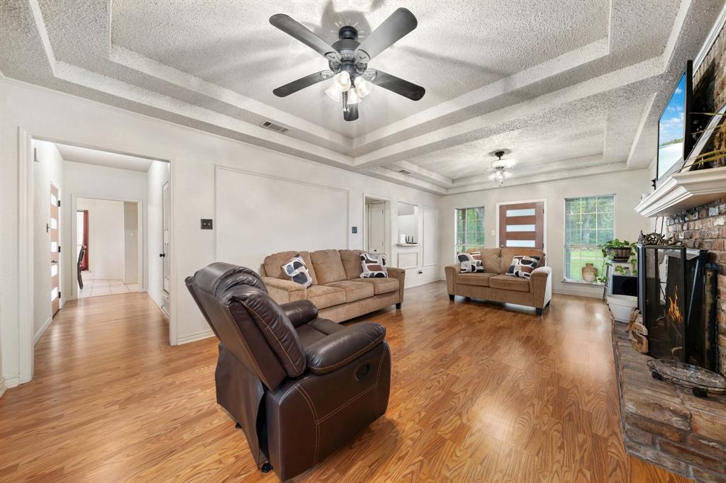 104 Pecan Grove Lancaster, TX 75146 - Photo 6 of 33 a living room with furniture and a flat screen tv