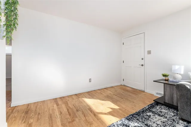 a bedroom with a bed and cabinets