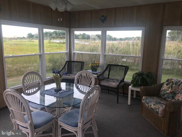 10577 Harrison Point Road Deal Island, MD 21821 - Photo 30 of 36 a living room with furniture and windows