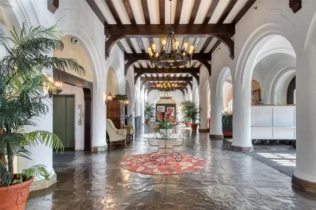 a view of hall way with furniture