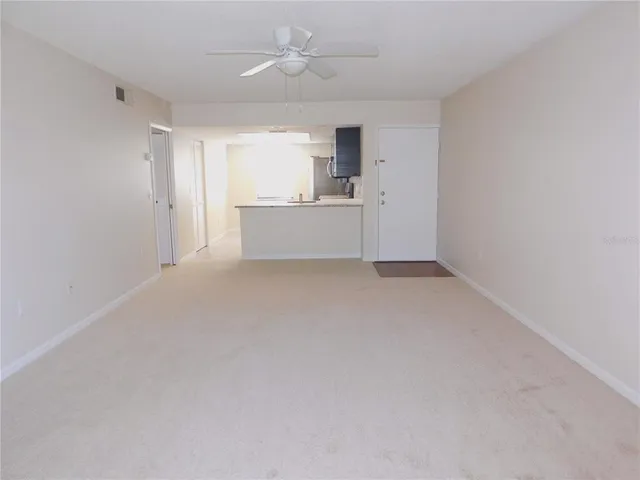 a view of a kitchen with a sink and cabinet