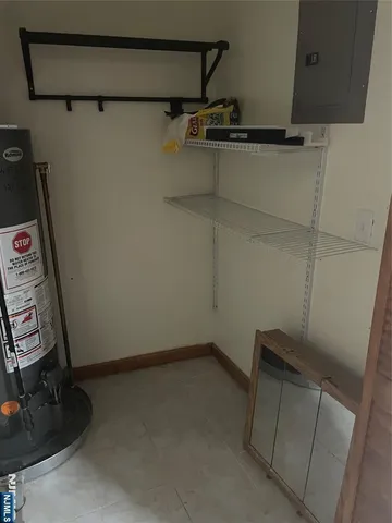 a view of storage and utility room with racks on the wall
