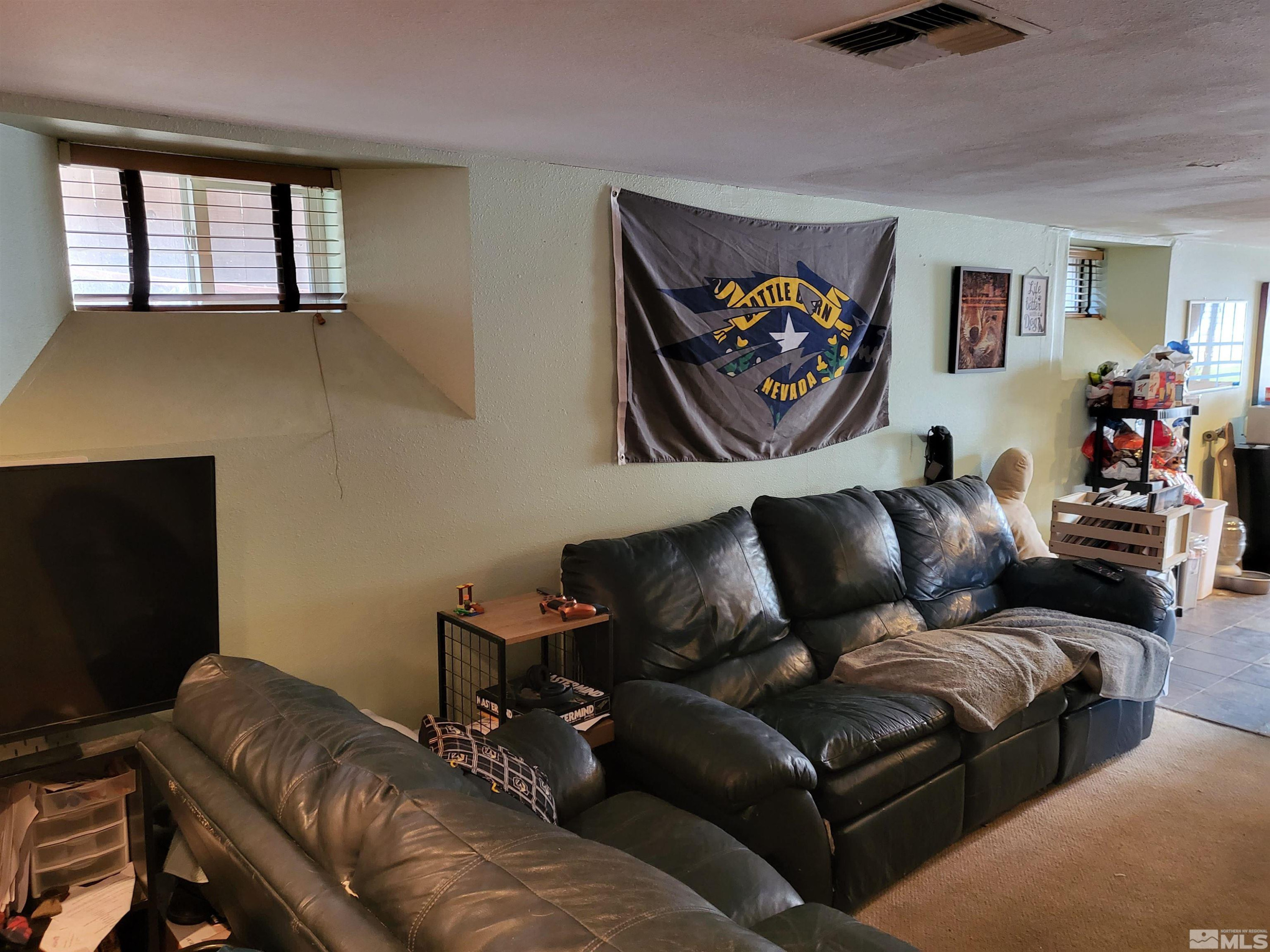 1347 Terrace Drive Reno, NV 89503 - Photo 12 of 25 a living room with furniture and a flat screen tv