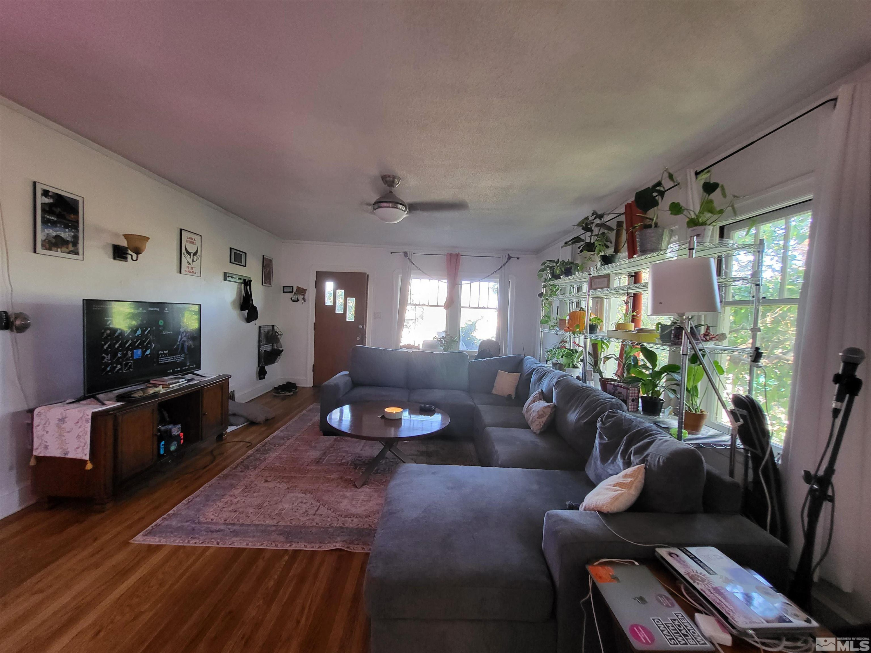 1347 Terrace Drive Reno, NV 89503 - Photo 9 of 25 a living room with furniture and a flat screen tv