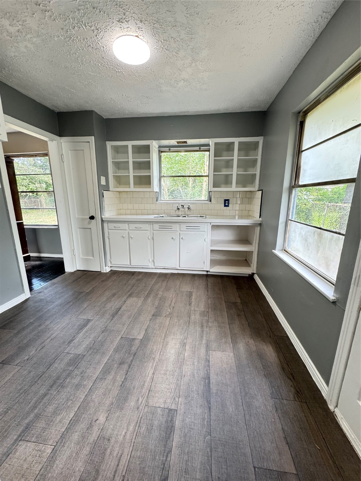 5254 Perry Street Houston, TX 77021 - Photo 15 of 16 wooden floor in an empty room with a window