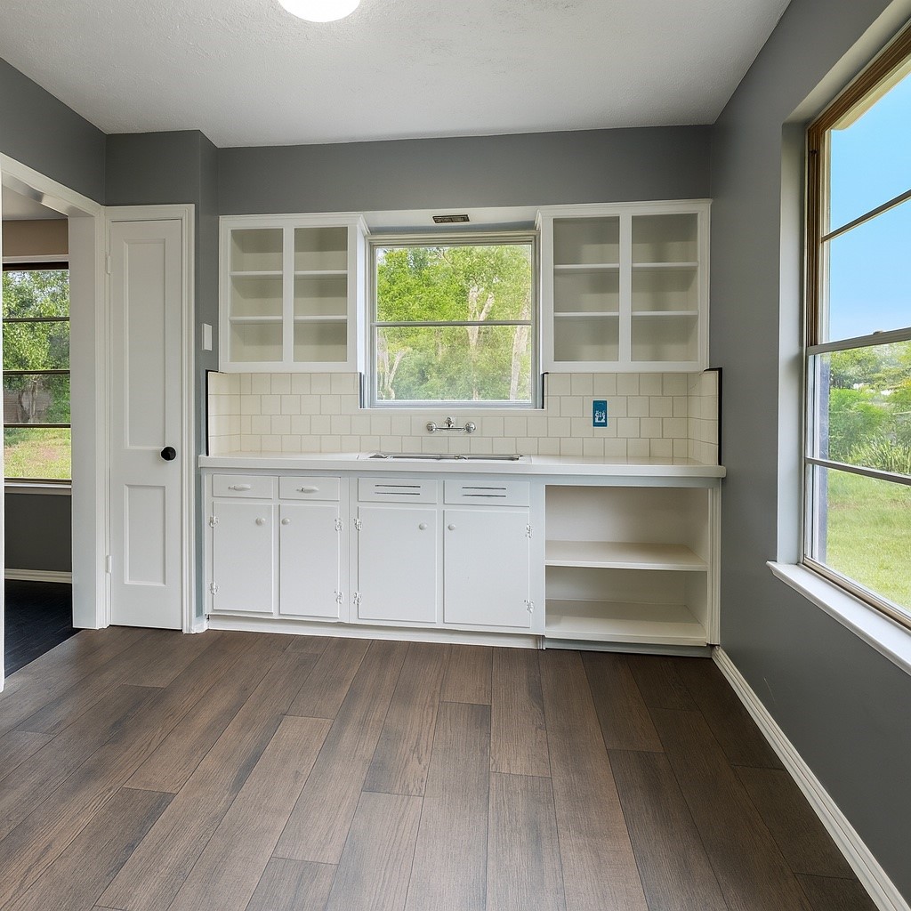 5254 Perry Street Houston, TX 77021 - Photo 4 of 16 an empty room with wooden floor and windows