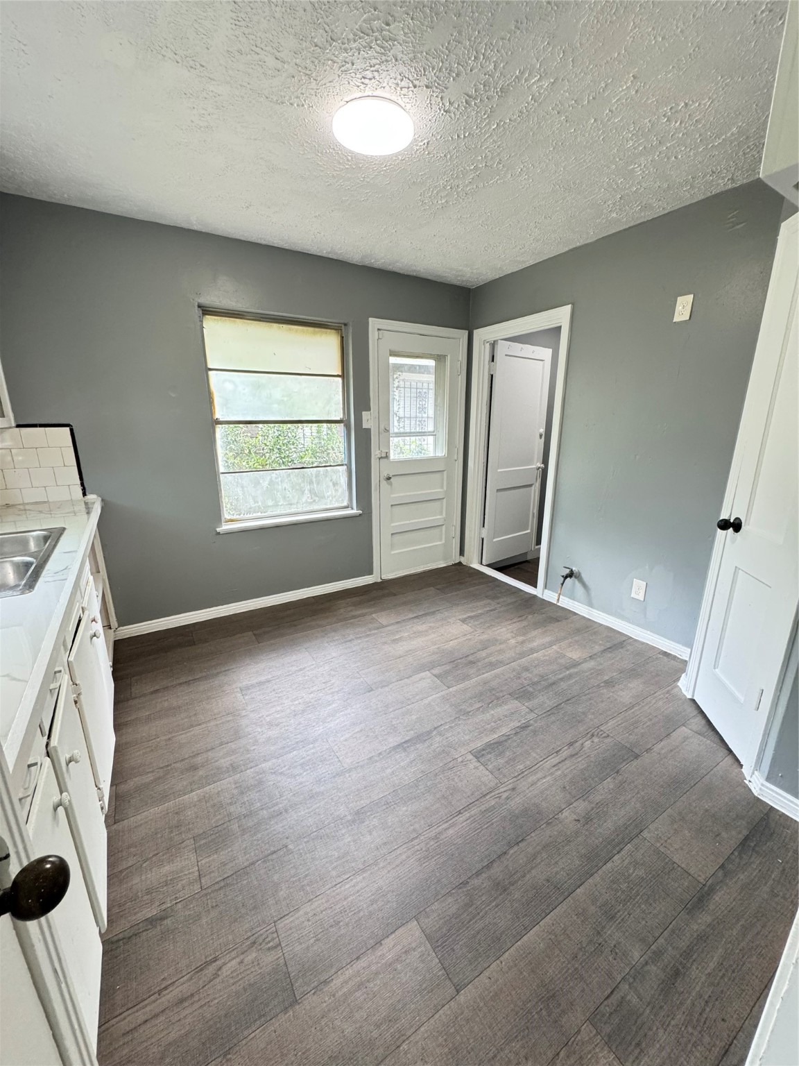 5254 Perry Street Houston, TX 77021 - Photo 5 of 16 a view of livingroom with window and hardwood floor