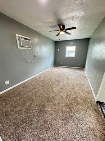 a view of a hallway with staircase