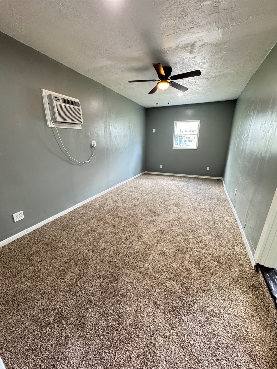 5254 Perry Street Houston, TX 77021 - Photo 10 of 16 a view of a livingroom with a ceiling fan and window