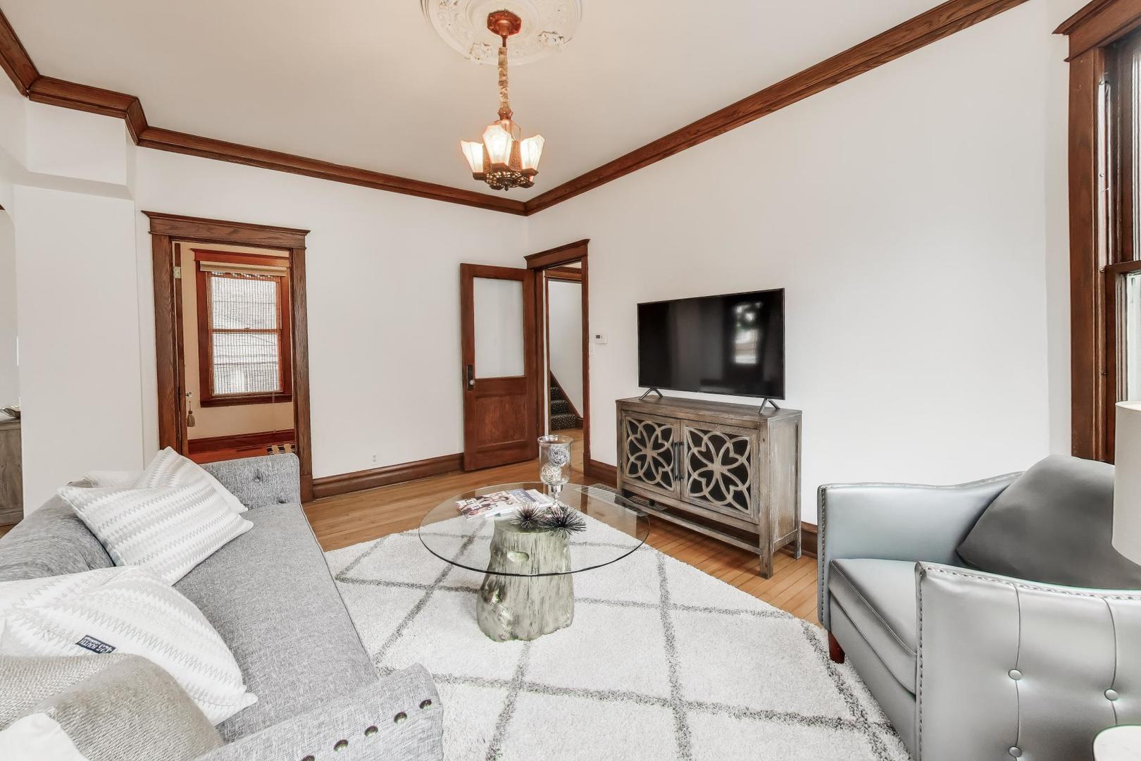 256 Blackhawk Road Riverside, IL 60546 - Photo 12 of 73 a living room with furniture and a flat screen tv