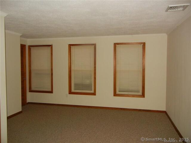 65 Old Route 79, Unit 13 Madison, CT 06443 - Photo 14 of 24 an empty room with windows