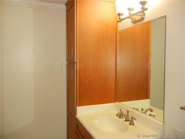 65 Old Route 79, Unit 13 Madison, CT 06443 - Photo 18 of 24 a bathroom with a sink and a mirror