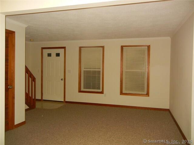 65 Old Route 79, Unit 13 Madison, CT 06443 - Photo 24 of 24 an empty room with windows