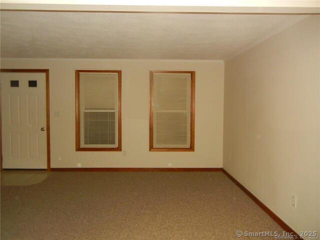 65 Old Route 79, Unit 13 Madison, CT 06443 - Photo 2 of 24 a view of a room that has a window