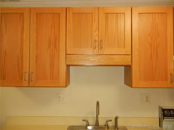 a kitchen with a sink a stove a refrigerator a washer and dryer