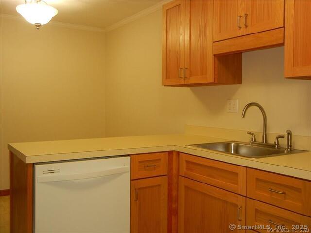65 Old Route 79, Unit 13 Madison, CT 06443 - Photo 8 of 24 a kitchen with a sink and cabinets