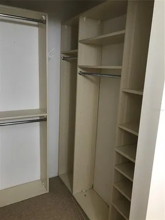 a view of an empty walk in closet