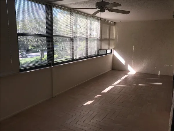 a view of an empty room with a window