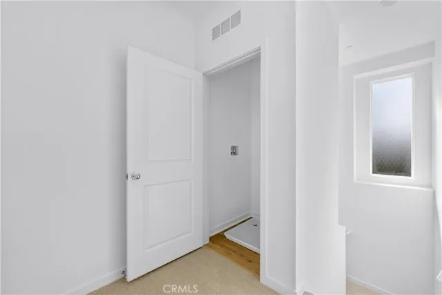 a view of hallway with closet