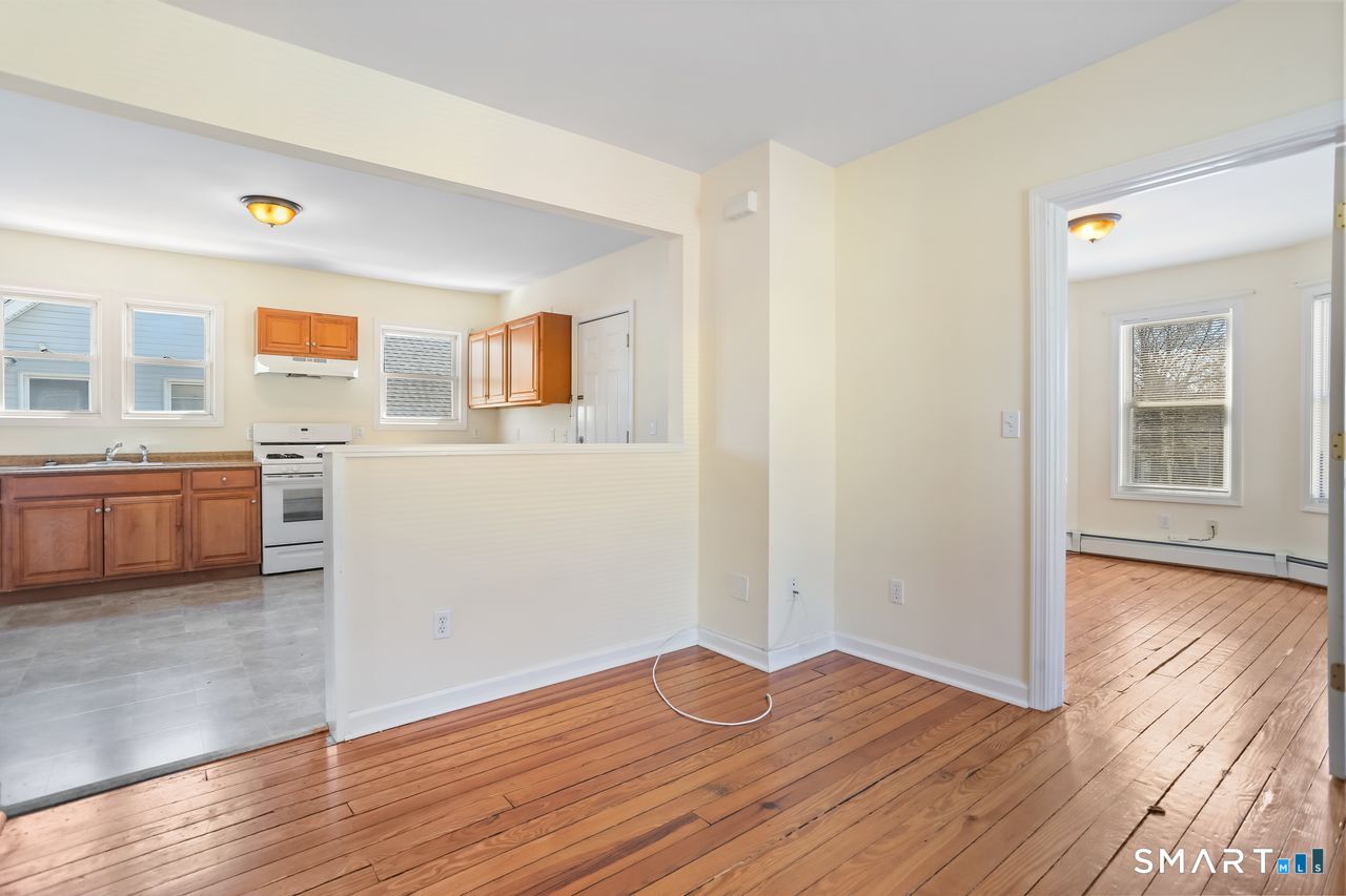 148 Alfred Street Bridgeport, CT 06605 - Photo 41 of 53 a view of a room with wooden floor and cabinet