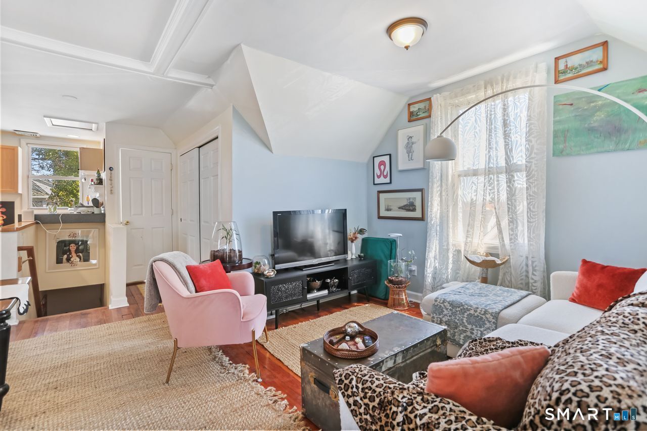 148 Alfred Street Bridgeport, CT 06605 - Photo 46 of 53 a bedroom with furniture and a flat screen tv