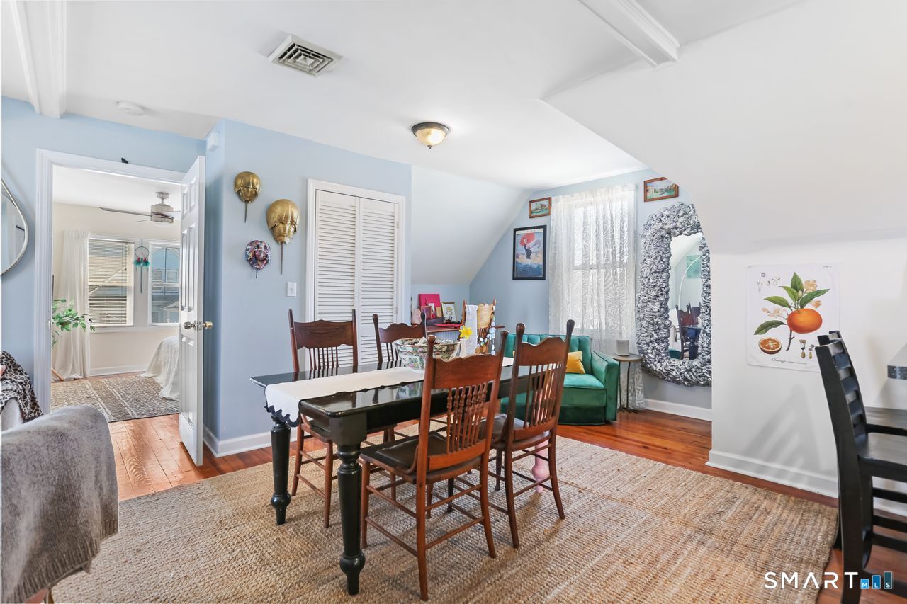 148 Alfred Street Bridgeport, CT 06605 - Photo 48 of 53 a view of a dining room with furniture and wooden floor