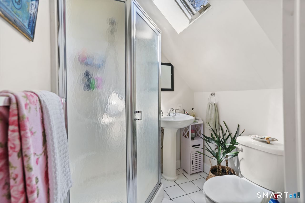 148 Alfred Street Bridgeport, CT 06605 - Photo 52 of 53 a bathroom with a sink toilet and shower